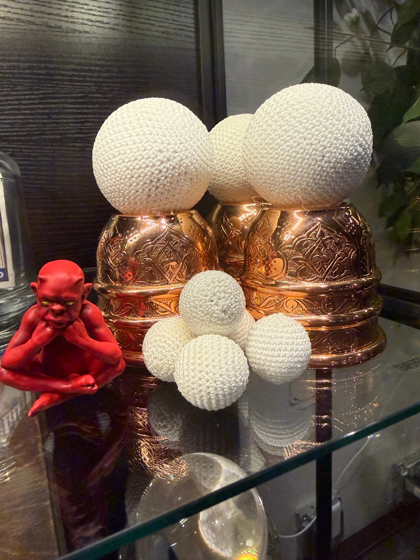 A detail from inside the parlour, curios glowing under glass